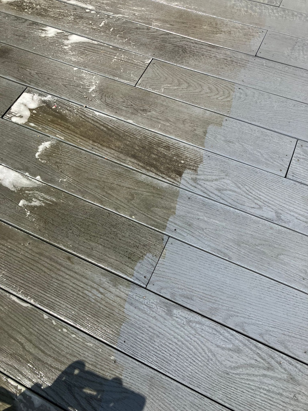 A slab patio, half washed